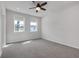 Bright bedroom with gray carpet, recessed lights, two windows, and a modern ceiling fan at 776 Clifftop Xing Xing, Powder Springs, GA 30127