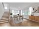 Bright dining room with a modern table set, hardwood floors, and ample natural light at 776 Clifftop Xing Xing, Powder Springs, GA 30127