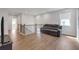 Upstairs loft area with hardwood flooring and comfortable seating, perfect for relaxation at 776 Clifftop Xing Xing, Powder Springs, GA 30127