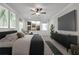 Serene main bedroom featuring calming decor, a large TV, and natural light at 776 Clifftop Xing Xing, Powder Springs, GA 30127