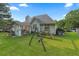 Expansive backyard with a play set, covered gazebo and large trees providing shade at 107 Hearthstone Walk, Woodstock, GA 30189