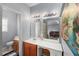 Bathroom featuring double sink, mirrors and bright lighting at 107 Hearthstone Walk, Woodstock, GA 30189