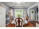 Bright dining room with a coffered ceiling, storage cabinets, and a window at 107 Hearthstone Walk, Woodstock, GA 30189