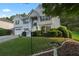 Well-maintained home with lush landscaping, a two-car garage, and stone accents at 107 Hearthstone Walk, Woodstock, GA 30189
