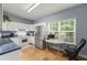 Bright kitchen with white cabinets, stainless steel appliances, and a window at 107 Hearthstone Walk, Woodstock, GA 30189