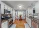 Updated kitchen with stainless steel appliances and cozy breakfast nook at 107 Hearthstone Walk, Woodstock, GA 30189