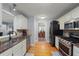Updated kitchen with stainless steel appliances and hardwood flooring at 107 Hearthstone Walk, Woodstock, GA 30189