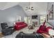 Cozy living room with fireplace, vaulted ceilings and adajacent dining area at 107 Hearthstone Walk, Woodstock, GA 30189