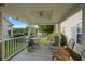 Charming porch with vintage furniture offering a relaxing outdoor space with a view of the neighborhood at 107 Hearthstone Walk, Woodstock, GA 30189