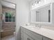 Bright bathroom featuring a spacious vanity, modern fixtures, and a tiled shower/tub combination, offering a serene space at 3074 Vinings Ridge Se Dr, Atlanta, GA 30339