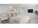 A cozy bedroom featuring neutral tones, stylish nightstand, soft bedding, and contemporary decor, inviting relaxation at 3074 Vinings Ridge Se Dr, Atlanta, GA 30339