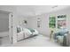 Cozy bedroom with large windows, a ceiling fan, and a comfy chair at 3074 Vinings Ridge Se Dr, Atlanta, GA 30339