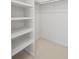 Organized walk-in closet featuring shelving for easy storage at 3074 Vinings Ridge Se Dr, Atlanta, GA 30339