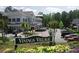 Exterior daytime view of Vinings Village featuring storefronts and ample parking at 3074 Vinings Ridge Se Dr, Atlanta, GA 30339