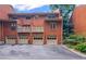Charming townhome featuring brick exterior, individual garages, and a well-maintained driveway in a desirable location at 3074 Vinings Ridge Se Dr, Atlanta, GA 30339