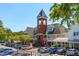 Daytime view of Vinings Village with its distinctive clock tower and surrounding storefronts at 3074 Vinings Ridge Se Dr, Atlanta, GA 30339