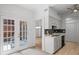 Bright kitchen next to double doors leading to an outdoor sitting area at 3074 Vinings Ridge Se Dr, Atlanta, GA 30339