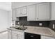Close-up of kitchen countertop, black backsplash, and cabinets at 3074 Vinings Ridge Se Dr, Atlanta, GA 30339