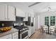 Modern kitchen featuring granite countertops, stainless steel appliances, and a breakfast nook at 3074 Vinings Ridge Se Dr, Atlanta, GA 30339