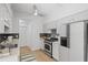 Bright kitchen featuring stainless steel appliances, granite countertops, and a modern backsplash at 3074 Vinings Ridge Se Dr, Atlanta, GA 30339