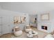 Living room featuring a fireplace, neutral color palette, and cozy seating arrangement at 3074 Vinings Ridge Se Dr, Atlanta, GA 30339