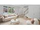Bright living room features large windows and a staircase leading upstairs at 3074 Vinings Ridge Se Dr, Atlanta, GA 30339