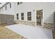 Back patio with concrete surface and view of the home's back door and facade at 174 Bluffington Way, Marietta, GA 30066