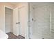 Bathroom showcasing glass shower with white subway tile and walk in closet at 174 Bluffington Way, Marietta, GA 30066