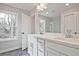 Bright bathroom features a double sink vanity, modern fixtures, and hexagon tile flooring at 174 Bluffington Way, Marietta, GA 30066