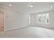 Light-filled bedroom featuring neutral carpeting and recessed lighting at 174 Bluffington Way, Marietta, GA 30066