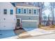 Charming townhome featuring a two-car garage, neutral paint, and a welcoming entrance, perfect for modern living at 174 Bluffington Way, Marietta, GA 30066
