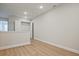 A bright upstairs hallway area features wood floors, lighting and a closet at 174 Bluffington Way, Marietta, GA 30066