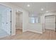 Open hallway featuring wood floors, modern lighting and access to other rooms at 174 Bluffington Way, Marietta, GA 30066