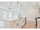 Beautiful kitchen showcasing stainless appliances, a central island with seating, and modern fixtures, great for Gathering meals at 174 Bluffington Way, Marietta, GA 30066