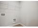 Laundry room with washer/dryer hookups and convenient wire shelving at 174 Bluffington Way, Marietta, GA 30066