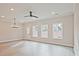 Spacious, naturally lit living area featuring sleek floors and multiple windows, creating a comfortable, inviting atmosphere at 174 Bluffington Way, Marietta, GA 30066