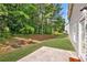 Backyard with grass, patio, and a view of the lush greenery at 1955 Pius Dr, Ellenwood, GA 30294