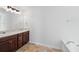 Bathroom featuring double sinks, vanity, and a bathtub at 1955 Pius Dr, Ellenwood, GA 30294