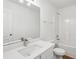 Modern bathroom featuring white vanity, sink, and shower-tub combo at 1955 Pius Dr, Ellenwood, GA 30294
