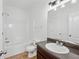Bathroom featuring a shower-tub combination and granite-look vanity at 1955 Pius Dr, Ellenwood, GA 30294