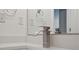 Modern bathroom features sleek fixtures and a stylish faucet at 1955 Pius Dr, Ellenwood, GA 30294