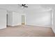 Expansive bedroom with neutral carpet and ceiling fan at 1955 Pius Dr, Ellenwood, GA 30294