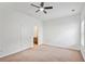 Bright bedroom with carpeted floor, ceiling fan and natural light from large window at 1955 Pius Dr, Ellenwood, GA 30294