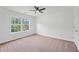 Bedroom featuring a ceiling fan and a view of the yard at 1955 Pius Dr, Ellenwood, GA 30294
