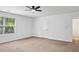 Bedroom features neutral carpet and a window with natural lighting at 1955 Pius Dr, Ellenwood, GA 30294