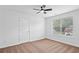 Bright bedroom with a ceiling fan and a large window at 1955 Pius Dr, Ellenwood, GA 30294