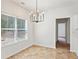 Bright breakfast nook featuring a modern chandelier and large window offering ample natural light at 1955 Pius Dr, Ellenwood, GA 30294