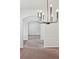 View of dining room with a modern chandelier and view into hallway at 1955 Pius Dr, Ellenwood, GA 30294