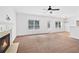 Open-concept living room with fireplace and windows offering natural light at 1955 Pius Dr, Ellenwood, GA 30294