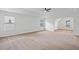 Expansive main bedroom with carpet, tray ceiling, and natural light from large windows at 1955 Pius Dr, Ellenwood, GA 30294